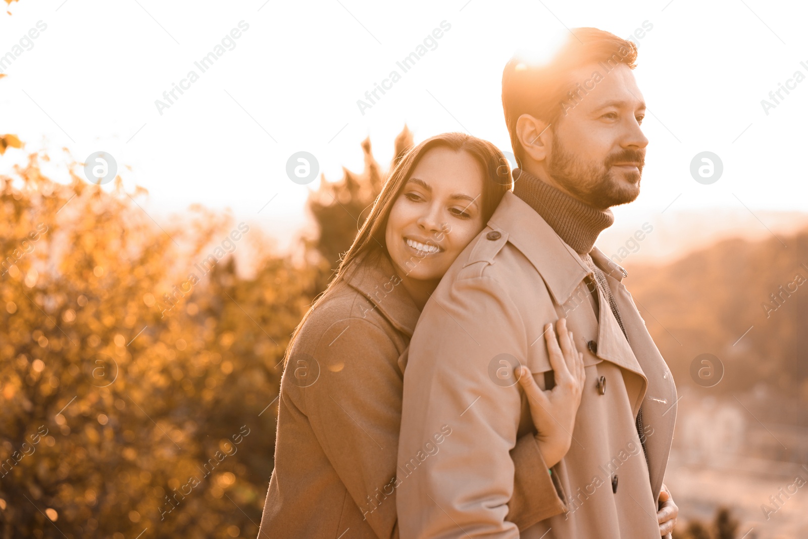 Photo of Beautiful couple enjoying their time together outdoors in autumn evening