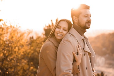 Photo of Beautiful couple enjoying their time together outdoors in autumn evening