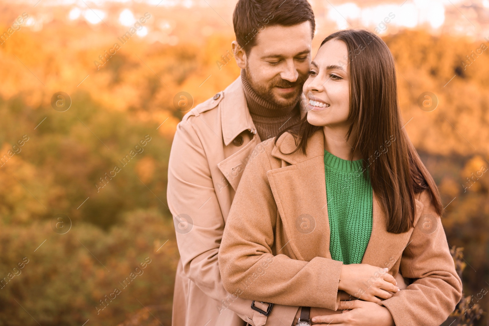 Photo of Beautiful couple outdoors on autumn day, space for text