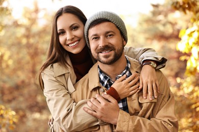 Portrait of beautiful couple outdoors on autumn day