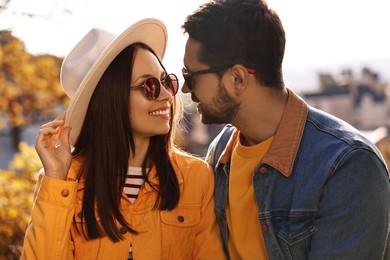 Photo of Beautiful couple in sunglasses outdoors on autumn day