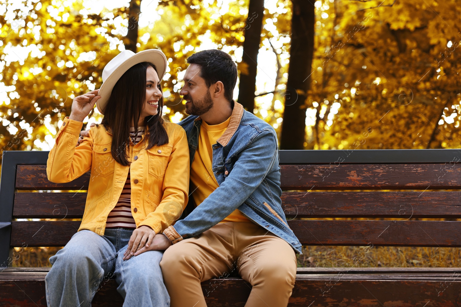 Photo of Beautiful couple spending time together in park on autumn day