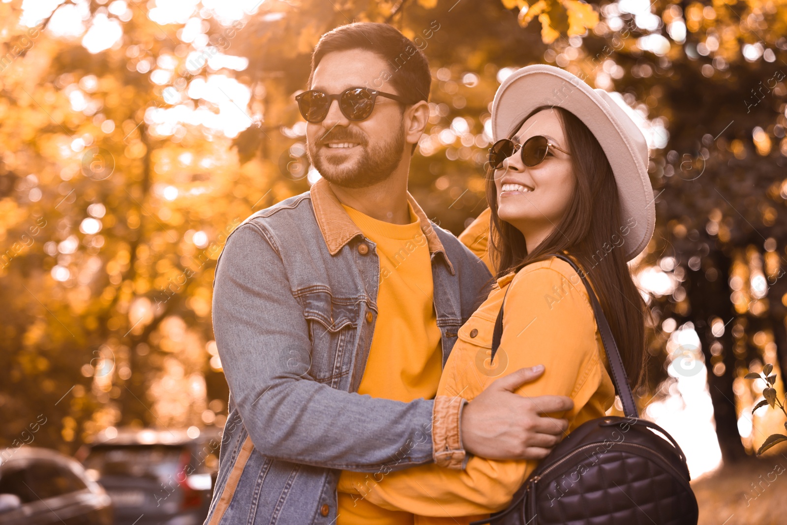 Photo of Beautiful couple hugging in park on autumn day