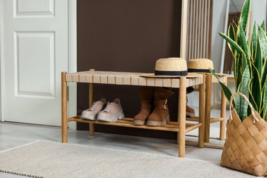 Photo of Stylish hallway interior with mirror and bench