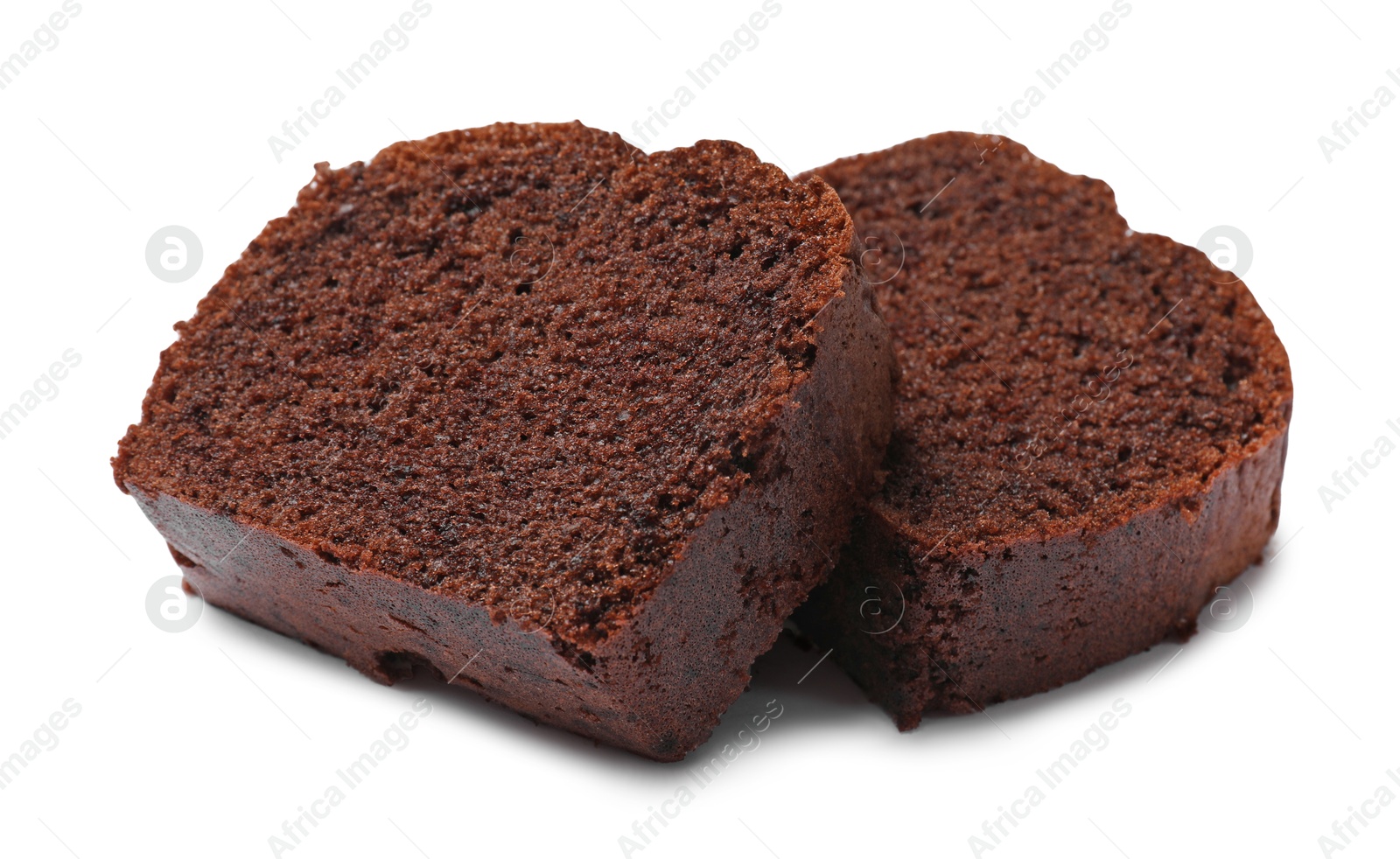 Photo of Slices of delicious chocolate sponge cake isolated on white