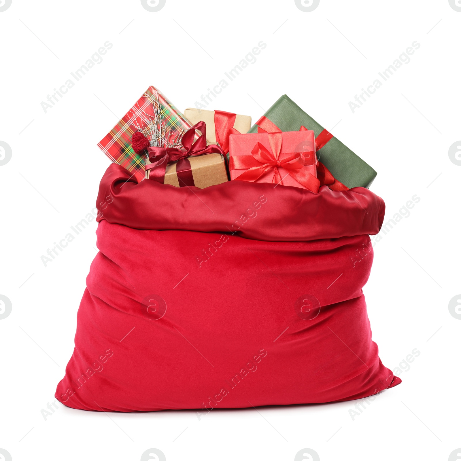 Photo of Santa Claus bag with gift boxes isolated on white