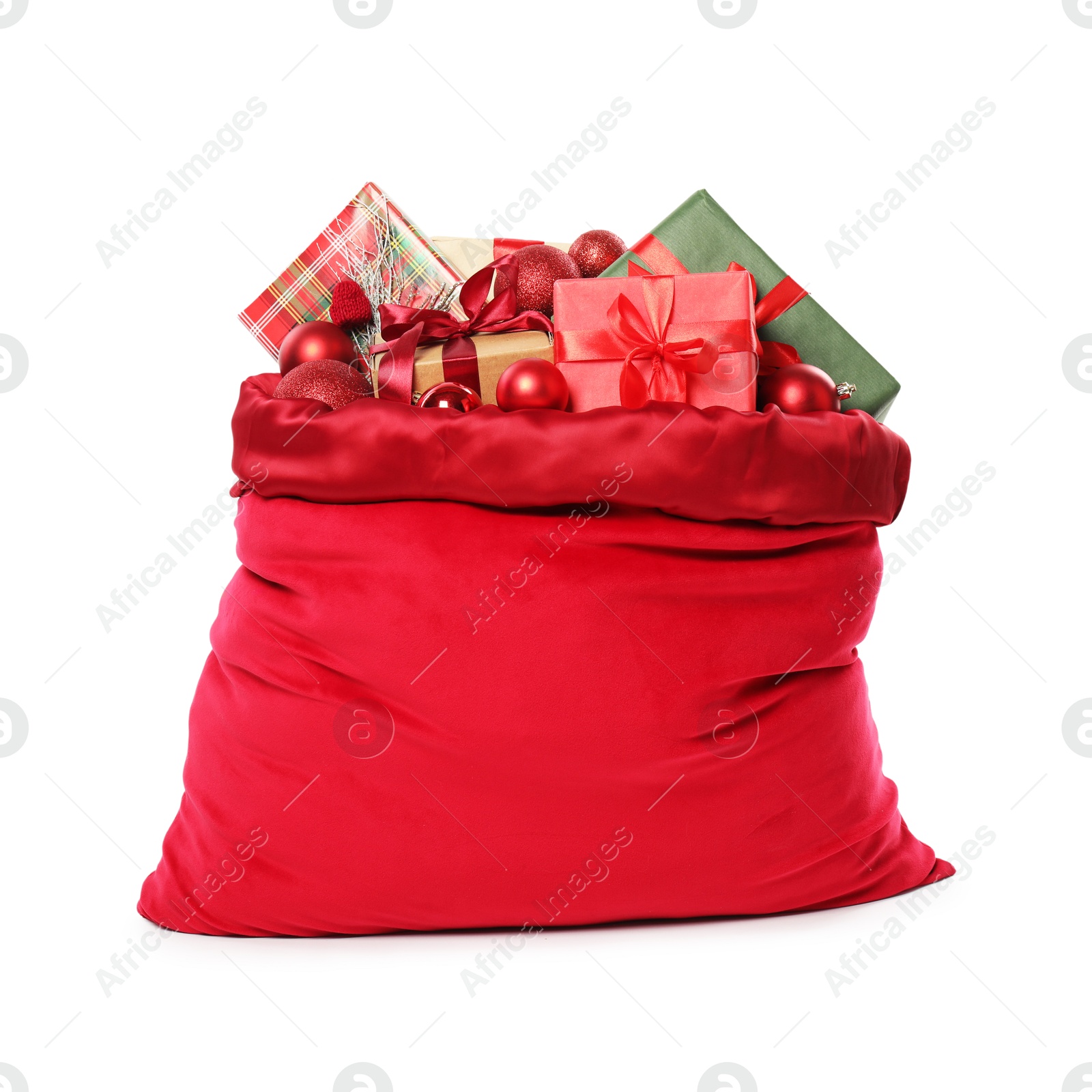 Photo of Santa Claus bag with gift boxes and Christmas balls isolated on white