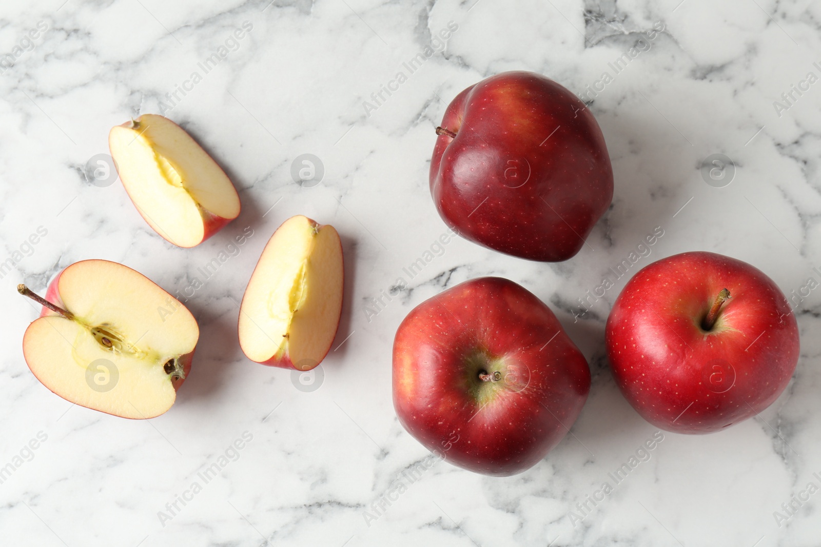 Ripe red apples on white marble table, top view Photo of Ripe red apples on white marble table, top view