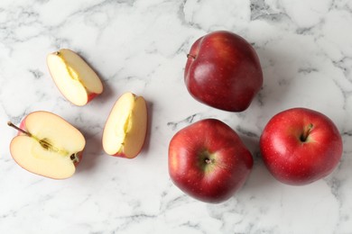 Photo of Ripe red apples on white marble table, top view