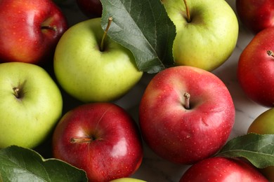 Photo of Ripe red and green apples on table, closeup