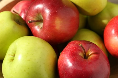 Photo of Ripe red and green apples as background, closeup