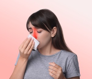 Woman with tissue suffering from sinusitis on gradient background