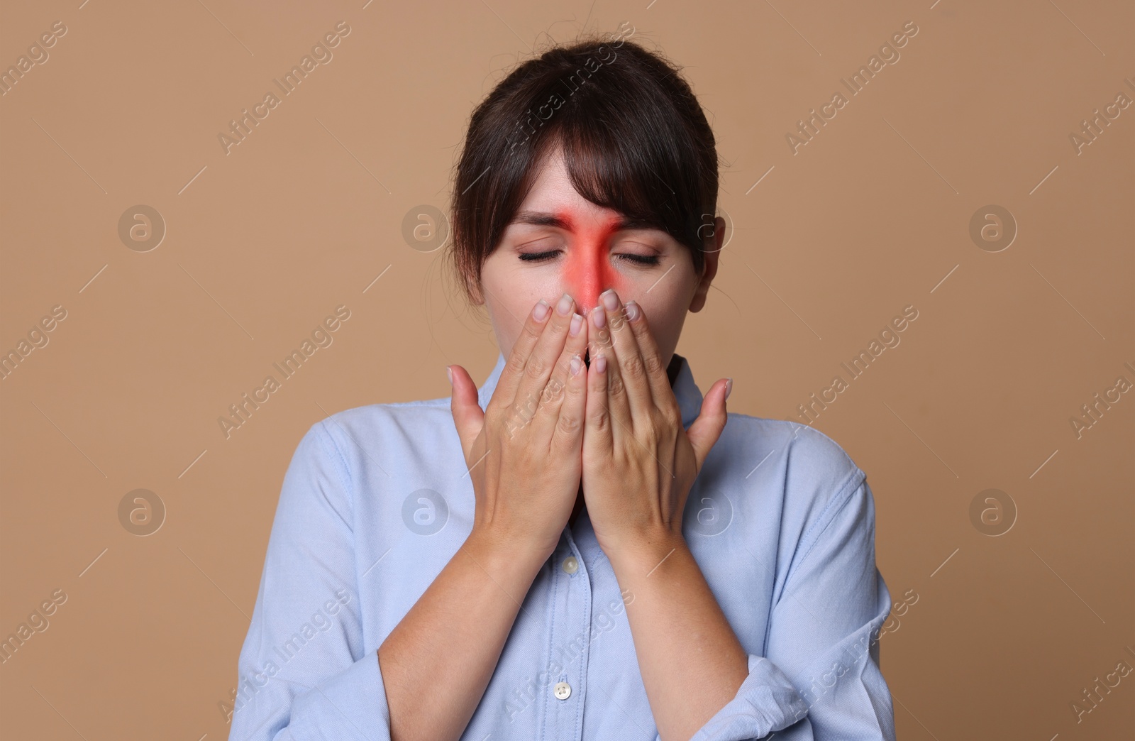 Image of Woman suffering from sinusitis on dark beige background