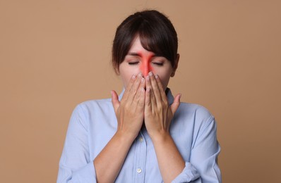 Image of Woman suffering from sinusitis on dark beige background