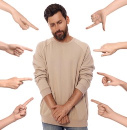 People pointing at embarrassed man on white background