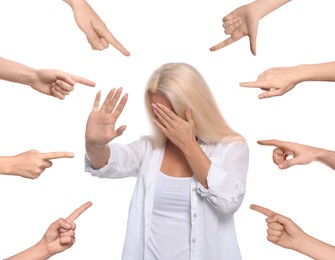 People pointing at embarrassed woman on white background