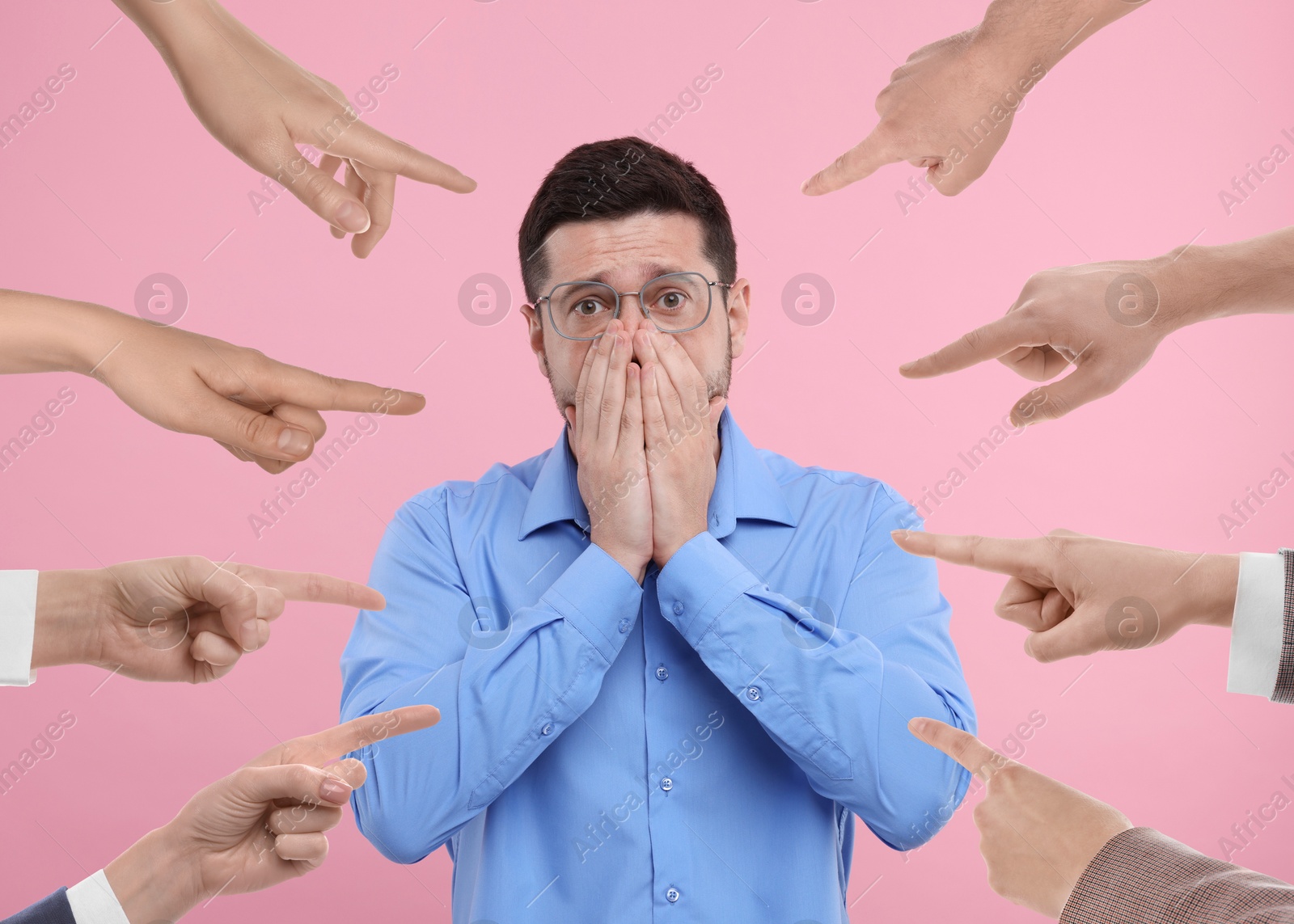 Image of People pointing at embarrassed man on pink background