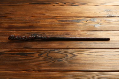 One old magic wand on wooden table