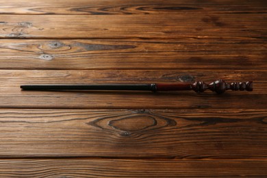 One old magic wand on wooden table