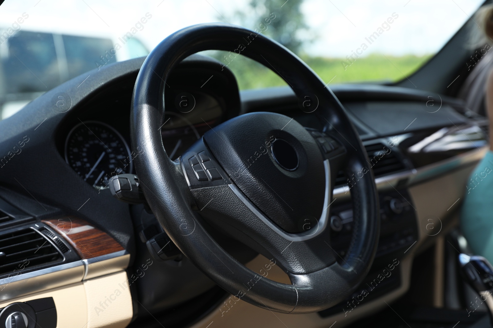 Photo of Steering wheel in modern car, view from inside