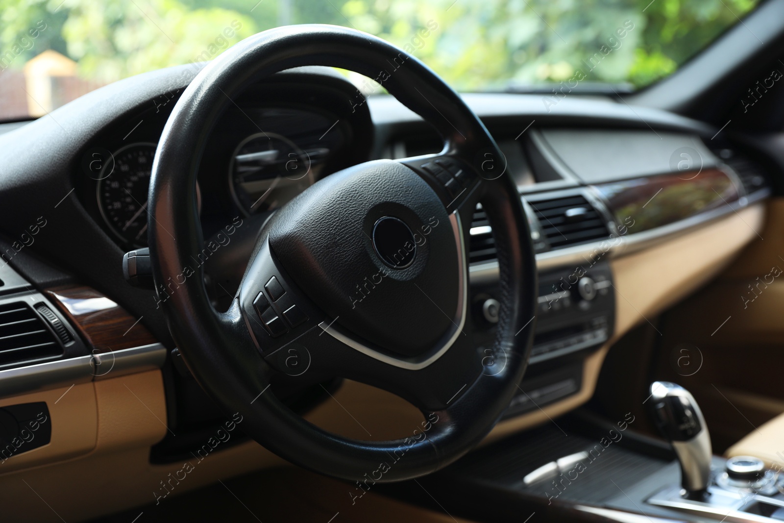 Photo of Steering wheel in modern car, view from inside