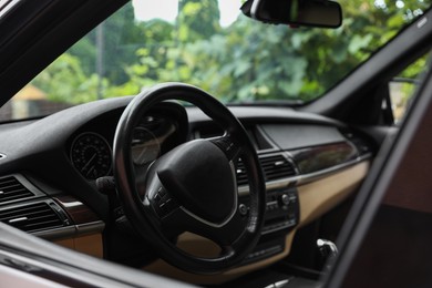 Photo of Steering wheel in modern car, view from outside