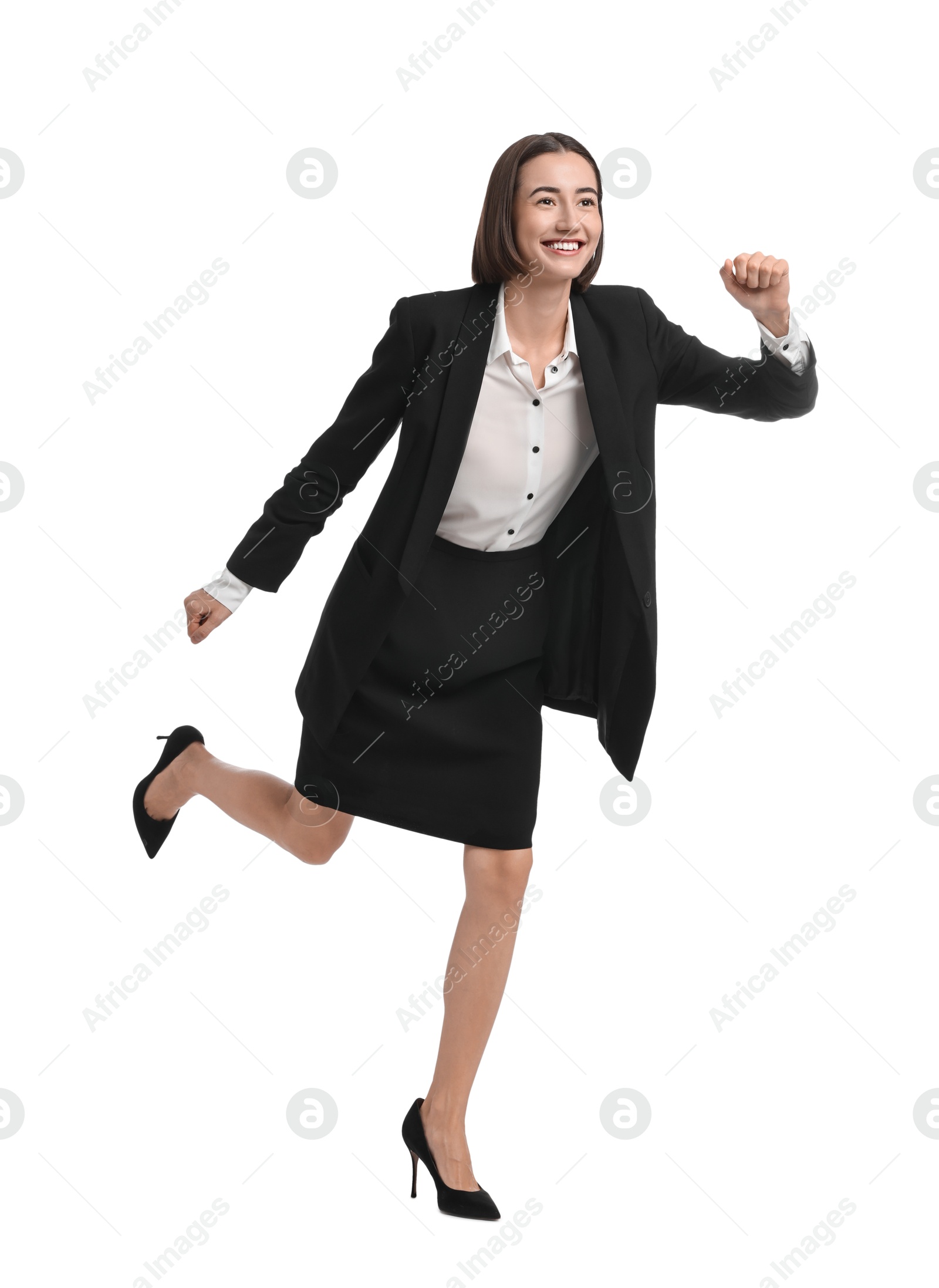 Photo of Young businesswoman in suit running on white background