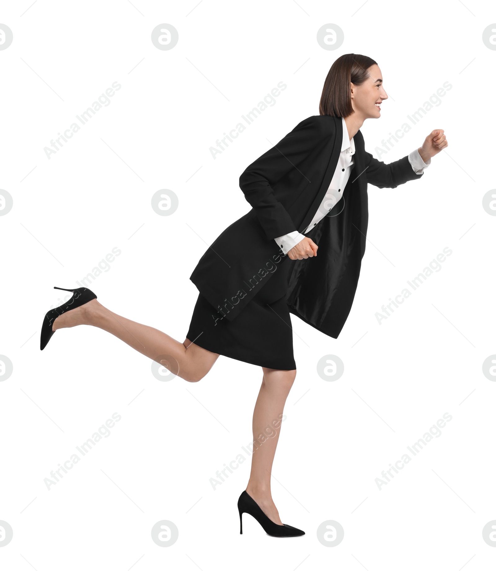 Photo of Young businesswoman in suit running on white background