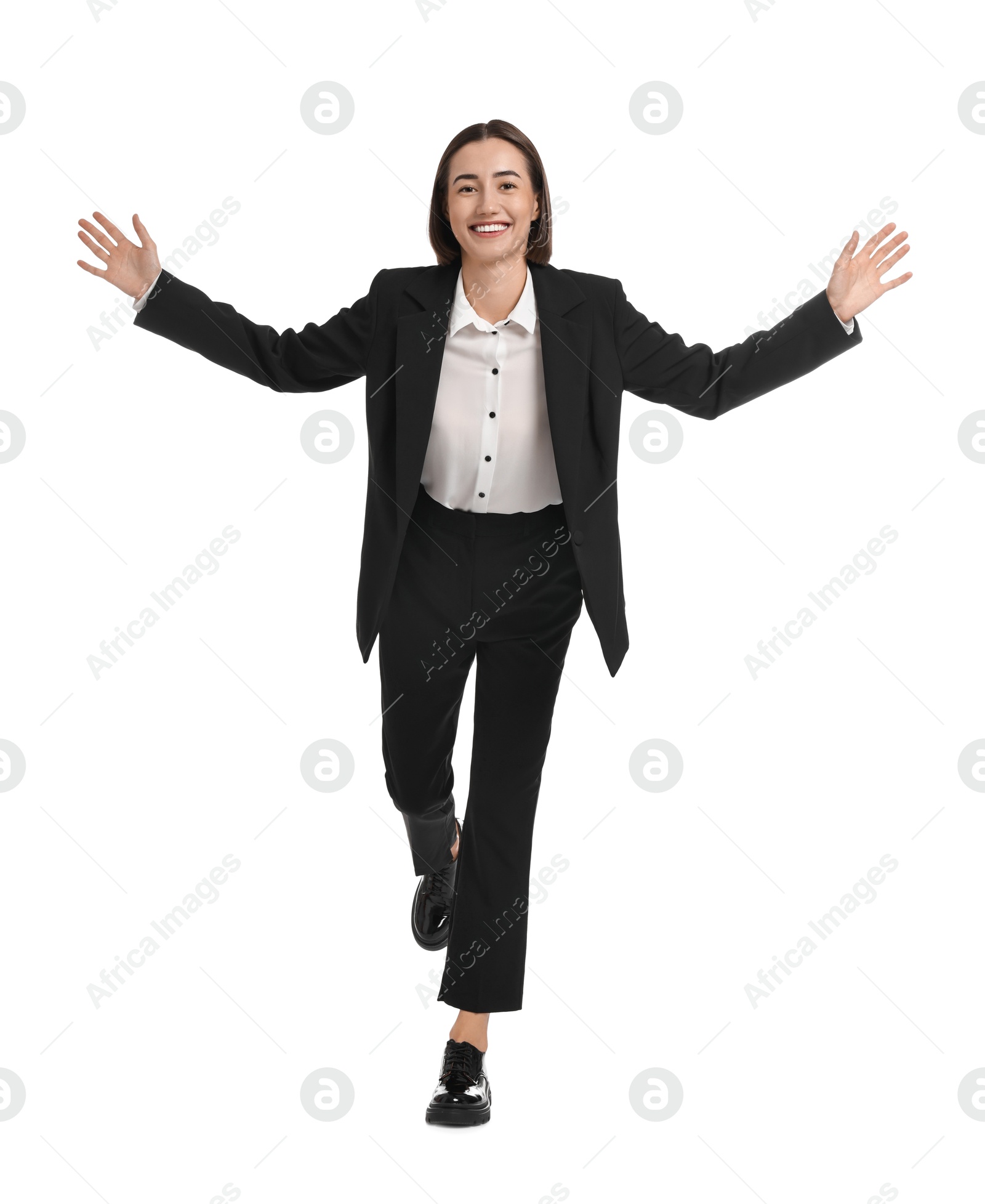 Photo of Young businesswoman in suit running on white background