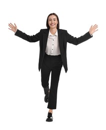 Young businesswoman in suit running on white background