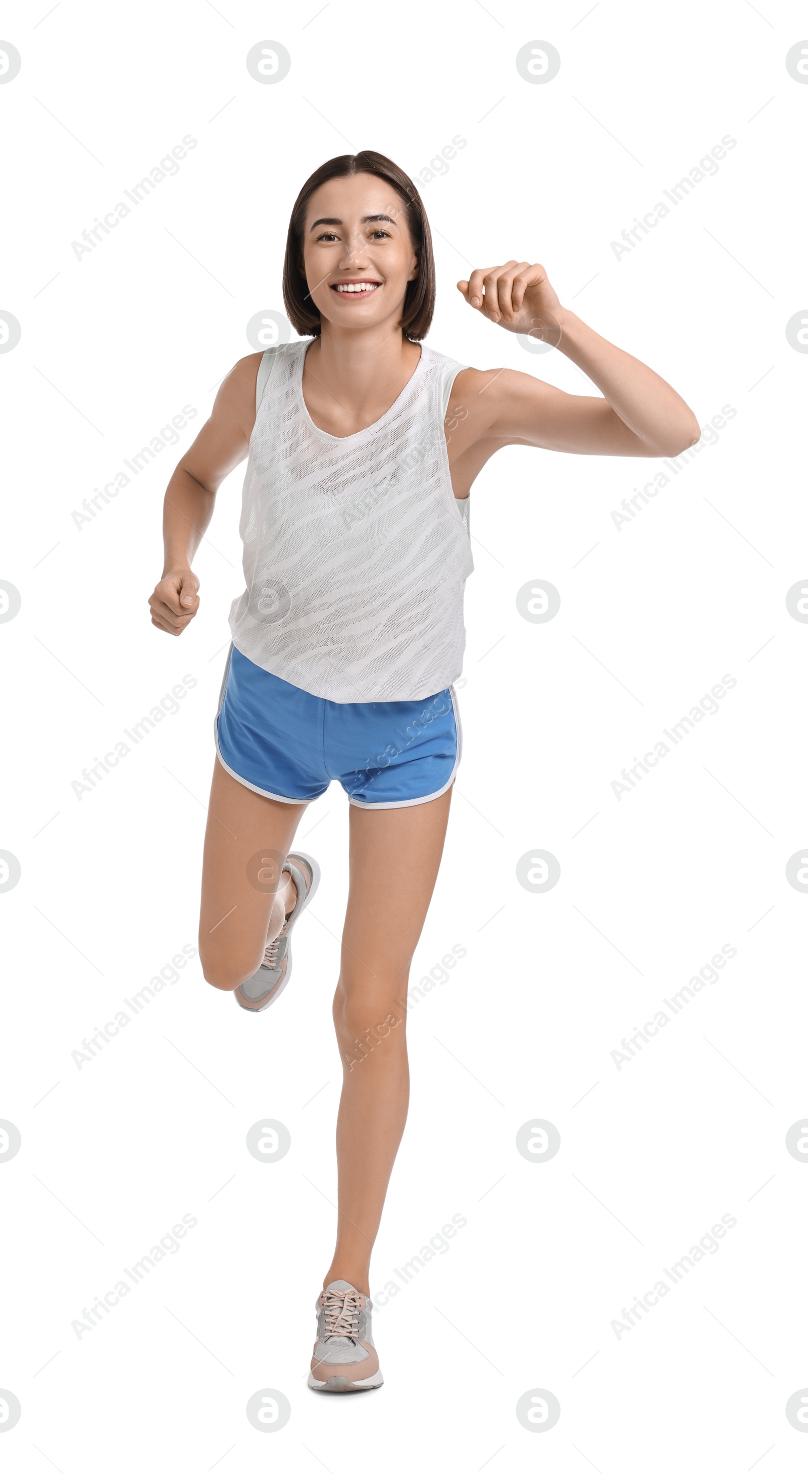 Photo of Beautiful woman in sportswear running on white background