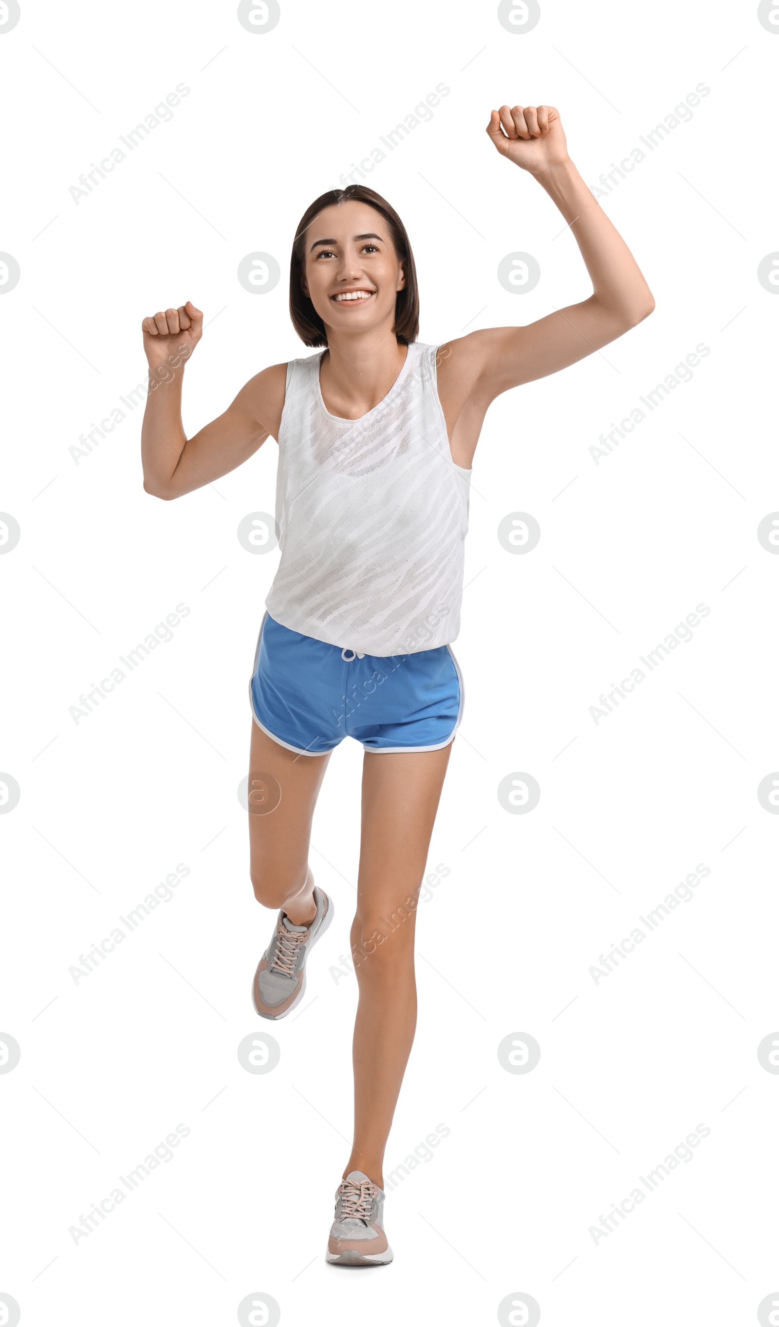 Photo of Beautiful woman in sportswear running on white background