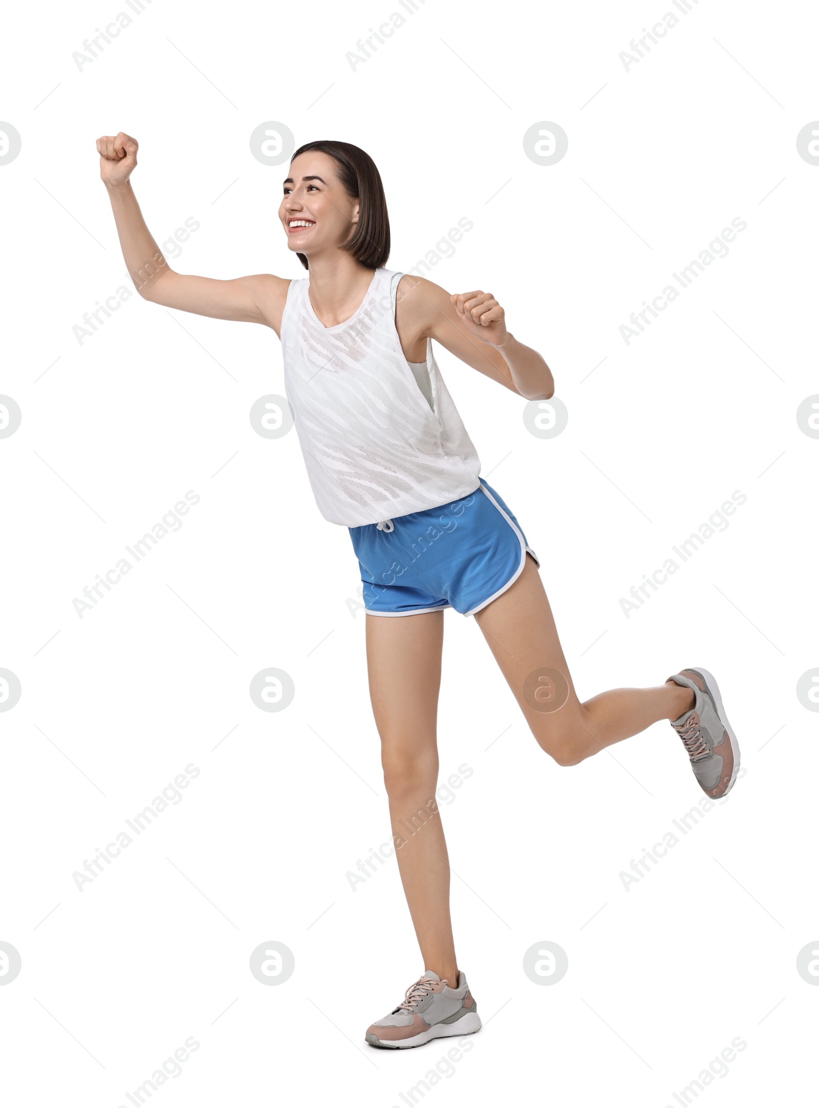 Photo of Beautiful woman in sportswear running on white background