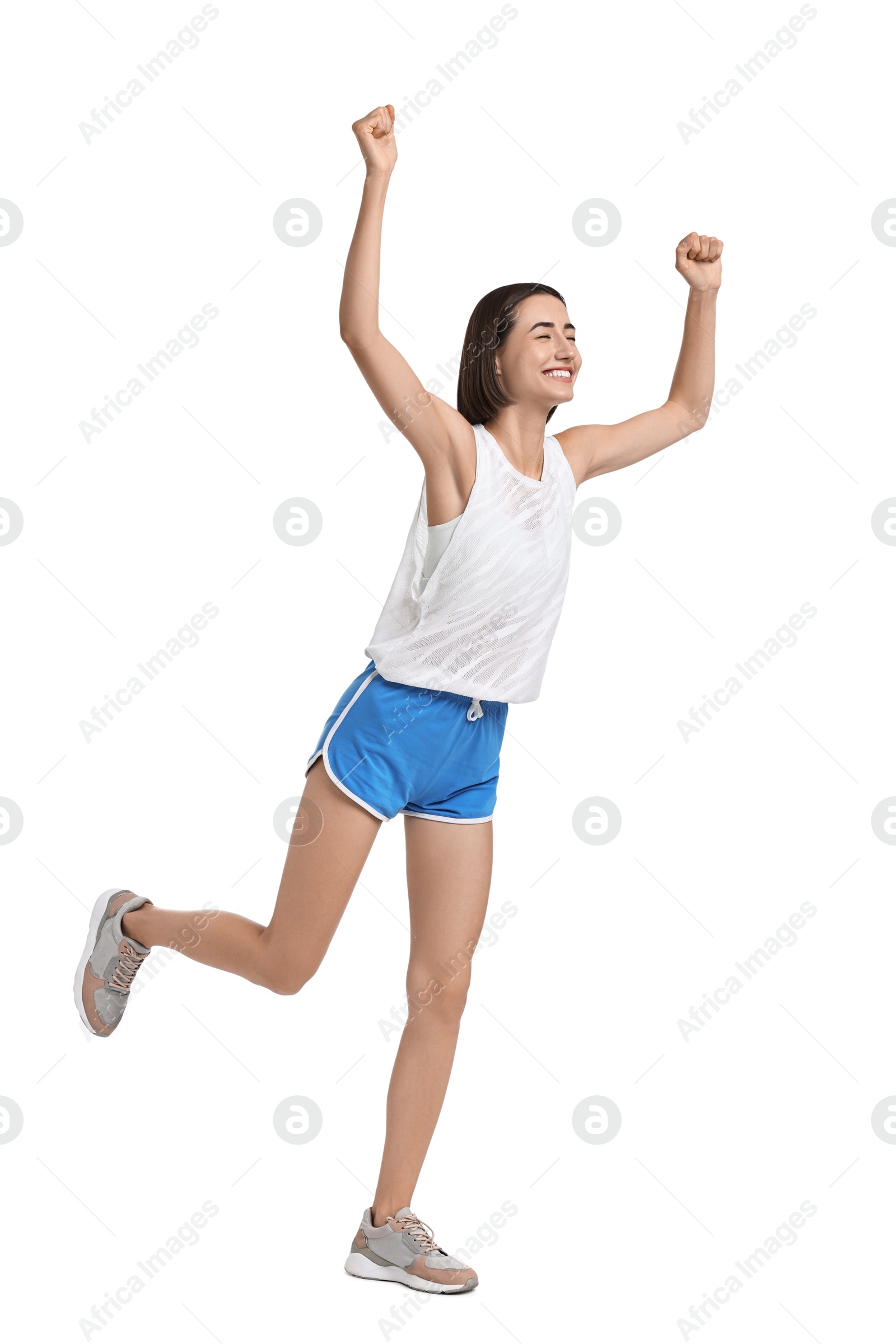 Photo of Beautiful woman in sportswear running on white background