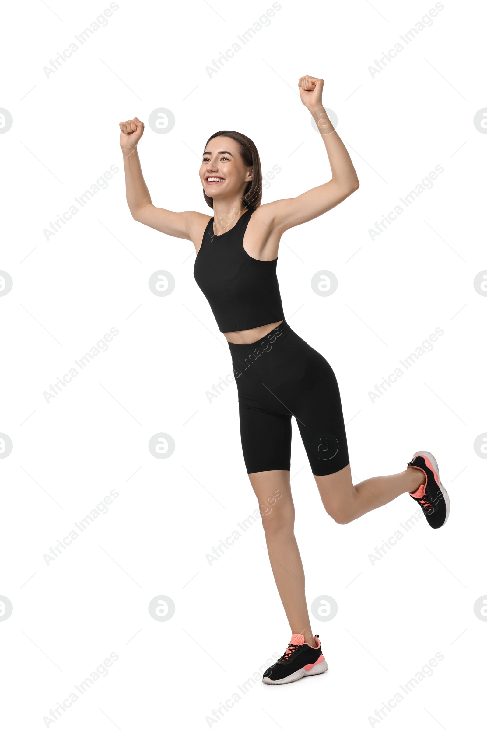 Photo of Beautiful woman in sportswear running on white background