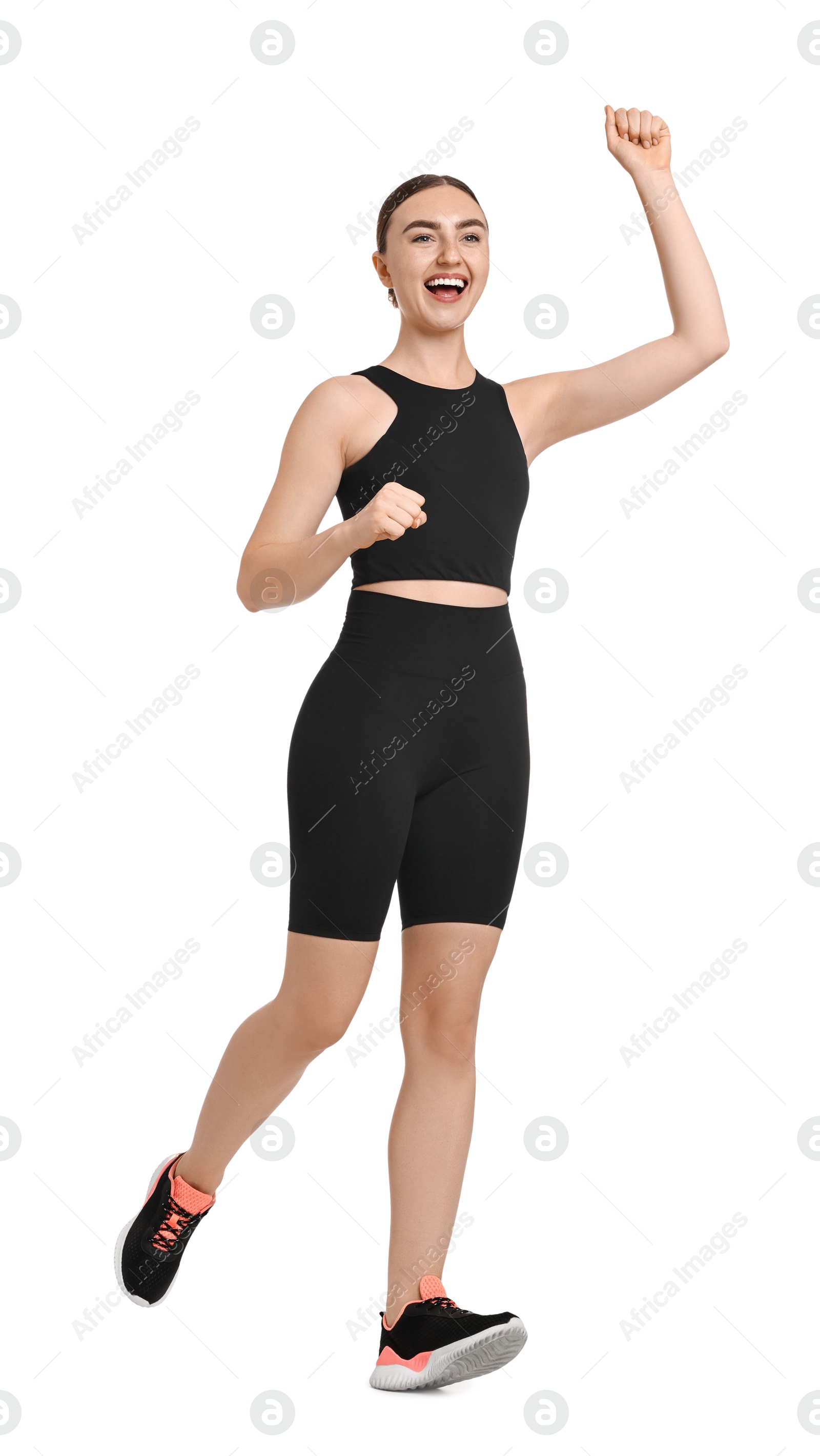 Photo of Beautiful woman in sportswear running on white background