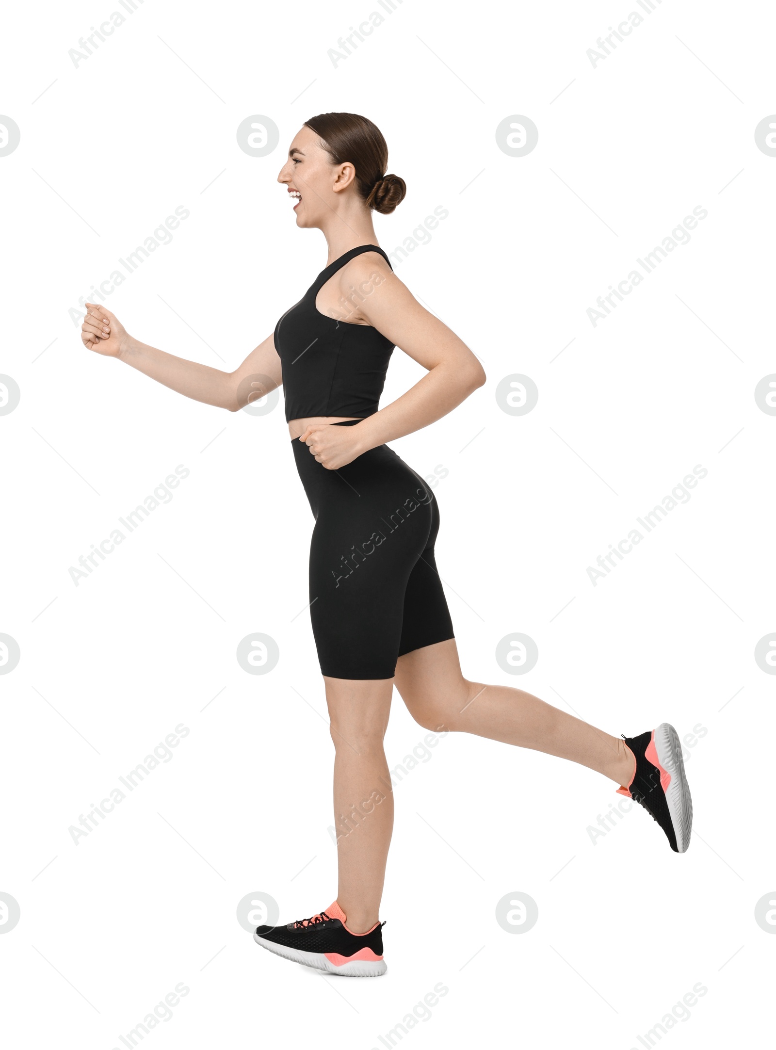 Photo of Beautiful woman in sportswear running on white background