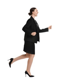 Photo of Young businesswoman in suit running on white background