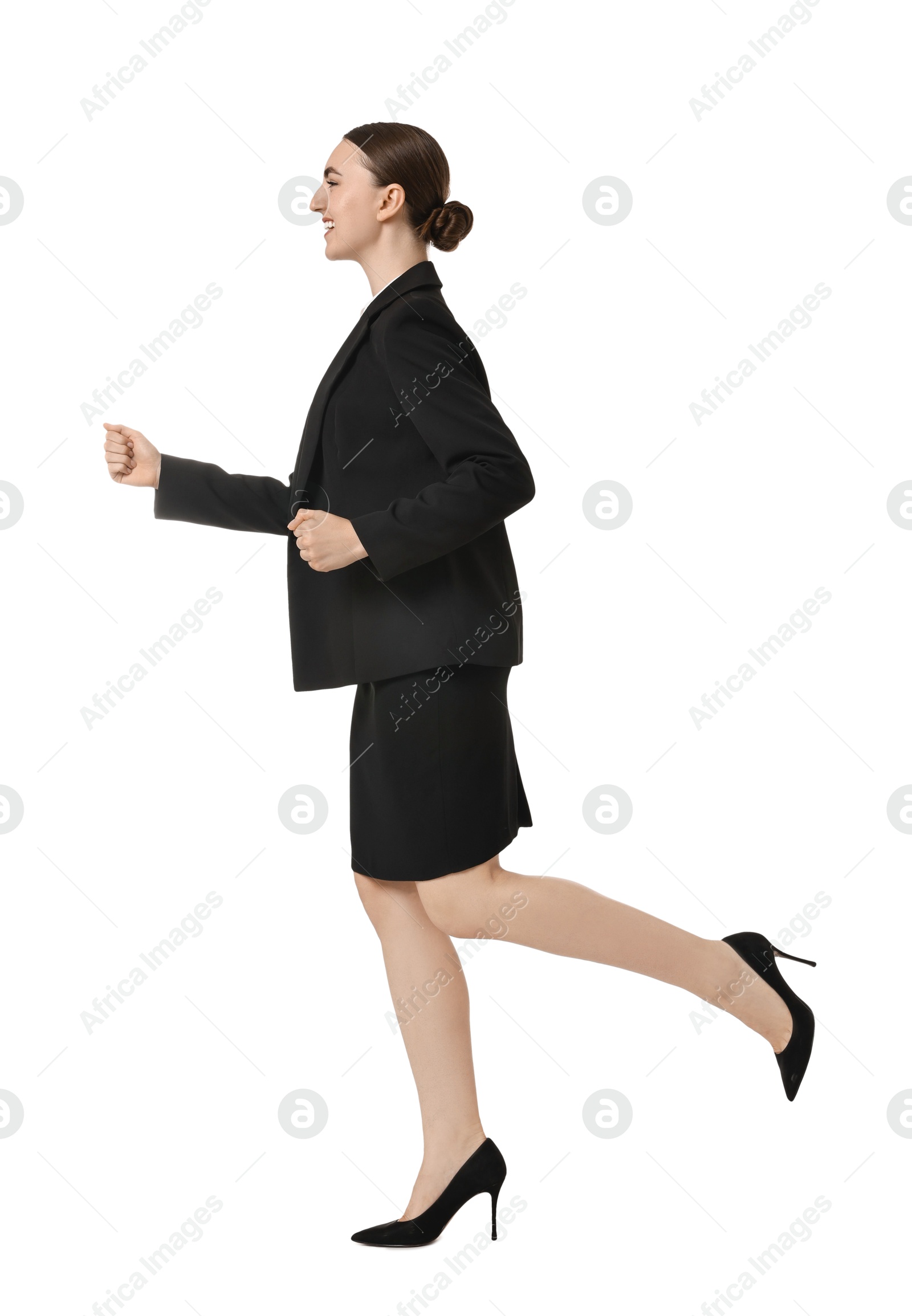 Photo of Young businesswoman in suit running on white background