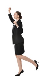 Photo of Young businesswoman in suit running on white background