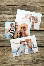 Different family photos on wooden table, flat lay