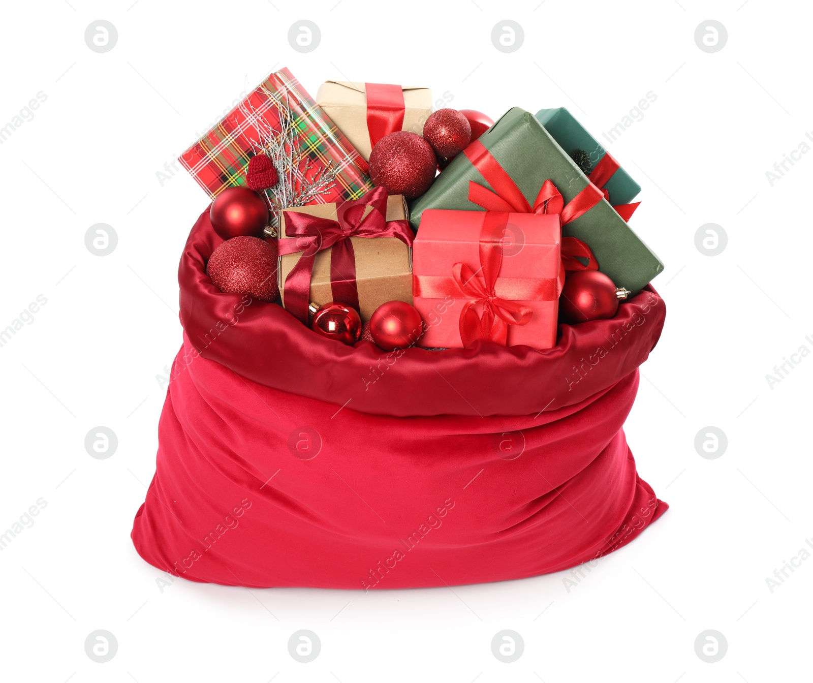 Photo of Santa Claus bag with gift boxes and Christmas balls isolated on white