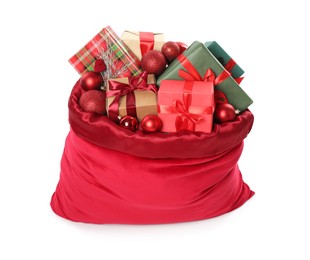 Photo of Santa Claus bag with gift boxes and Christmas balls isolated on white