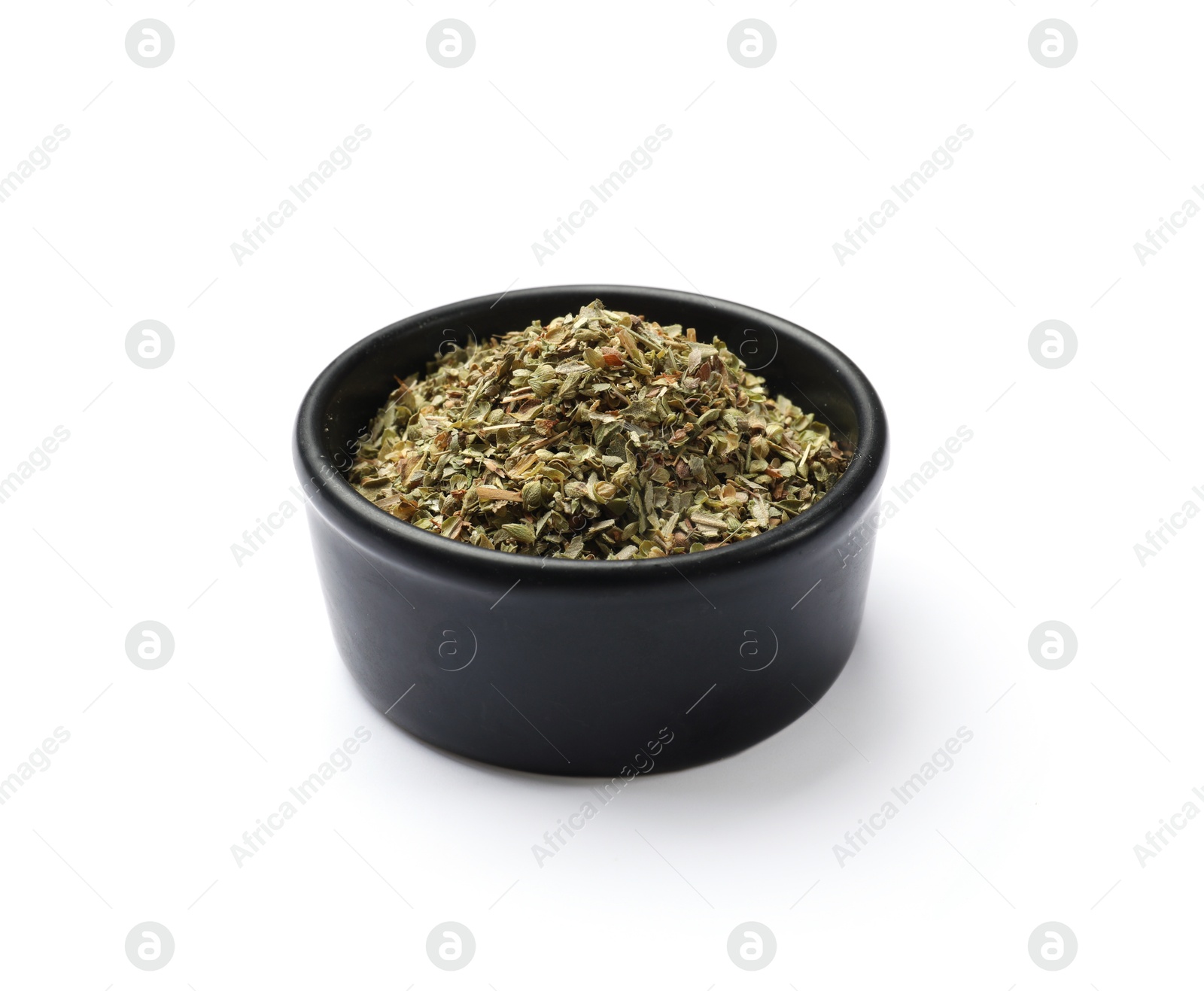 Photo of Dried oregano in bowl isolated on white