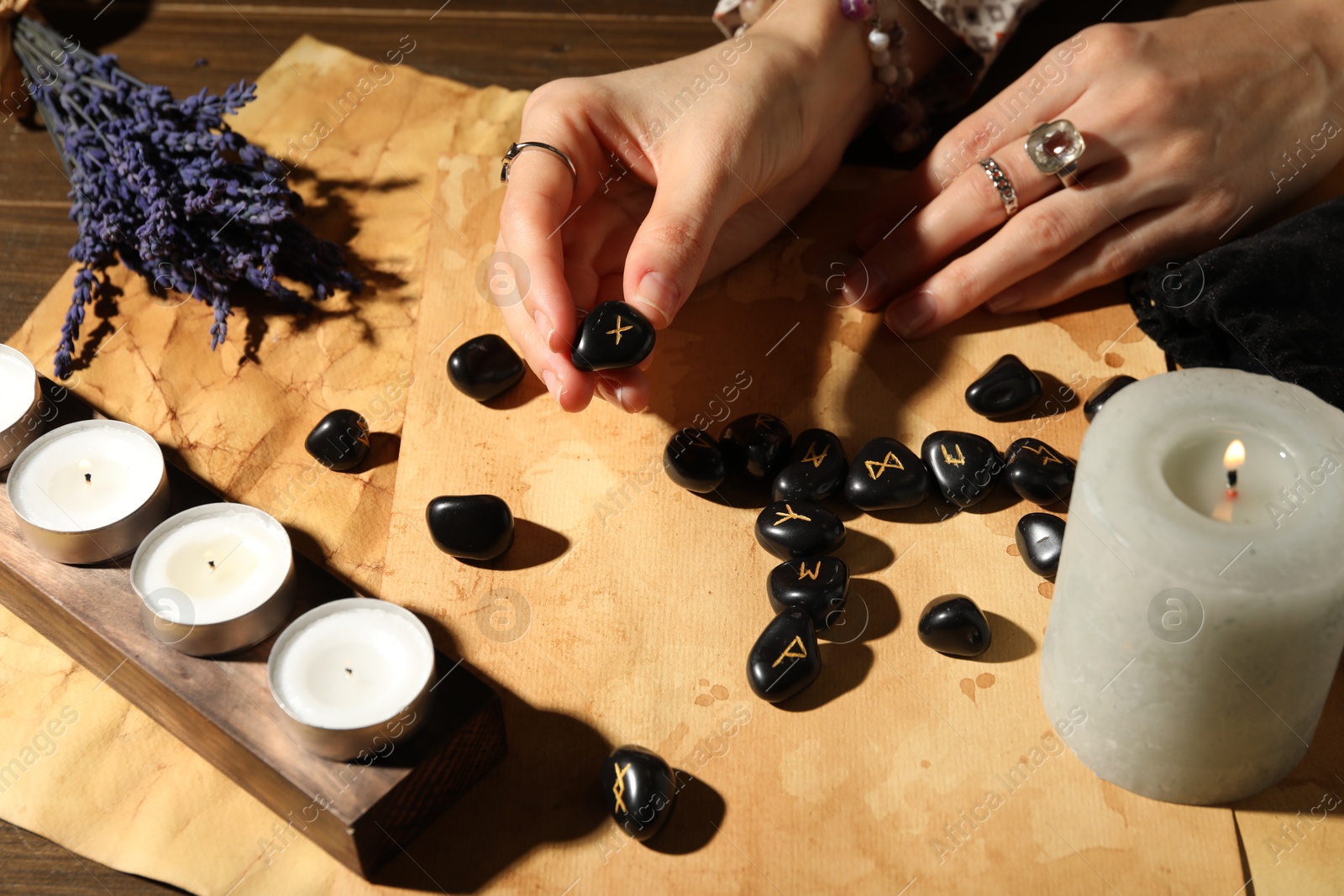 Photo of Woman with rune Gebo at table, closeup