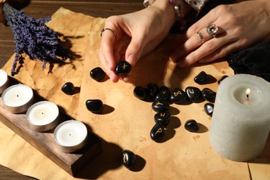 Photo of Woman with rune Gebo at table, closeup