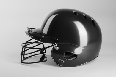 One black baseball helmet on white background