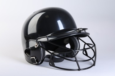 Photo of One black baseball helmet on white background