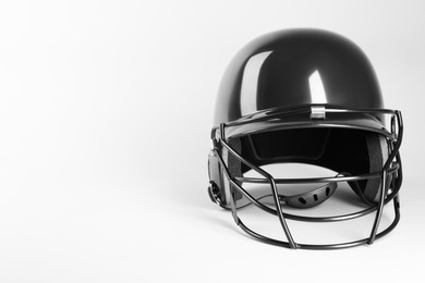 Photo of One black baseball helmet on white background, space for text