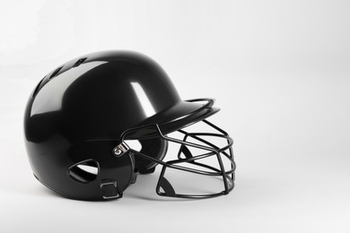 One black baseball helmet on white background